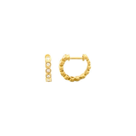 Gold and diamond bezel huggies earrings.