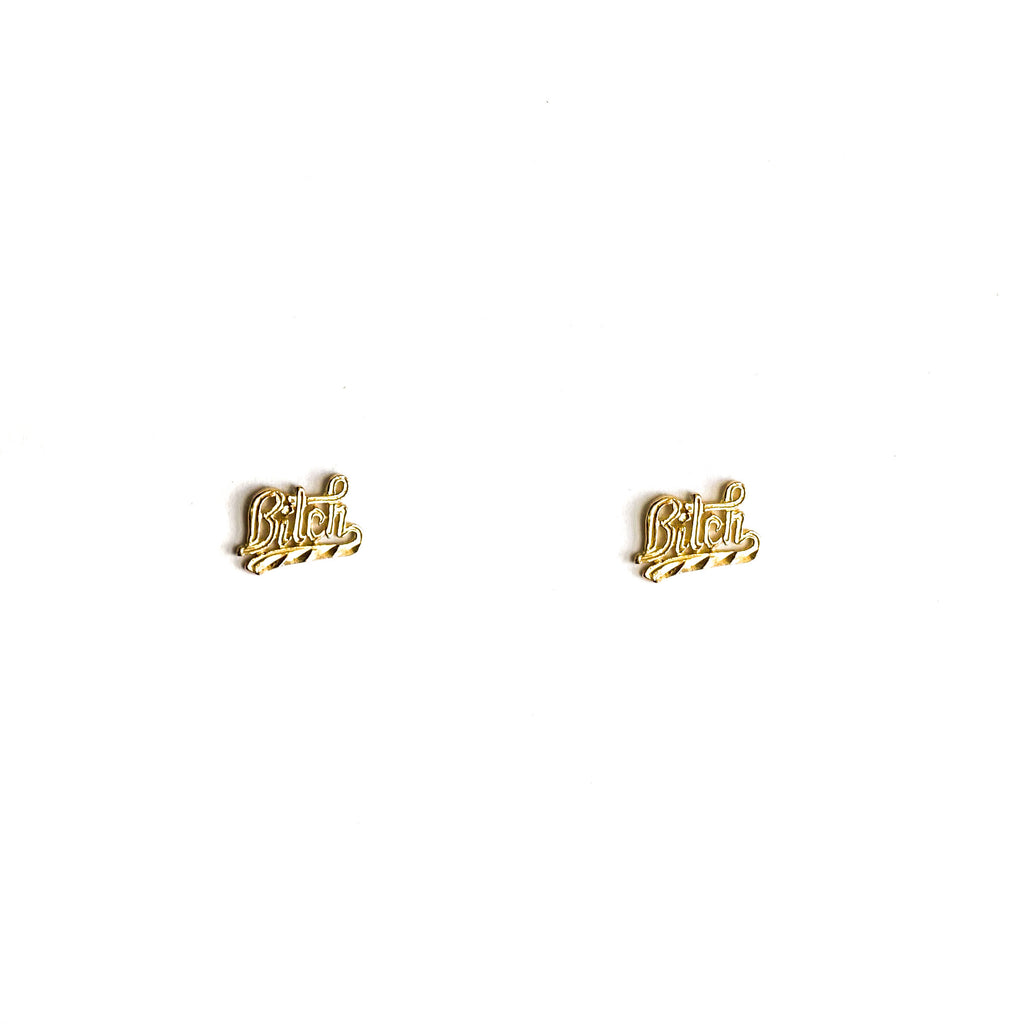 14k yellow gold "Bitch" script stud earrings.