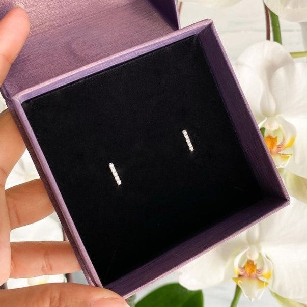 Diamond bar stud earrings. 
